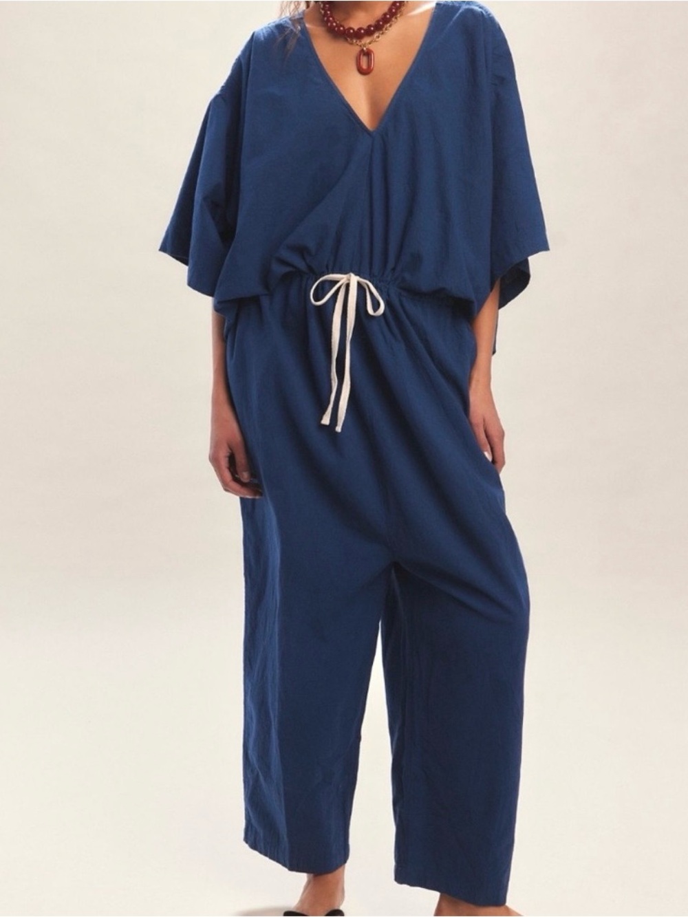 Free people Irving jumpsuit 
Color is called Sky Dive Drawstring waist